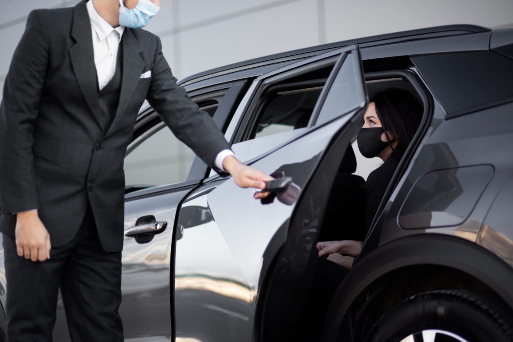 Young male being an uber driver for a female client